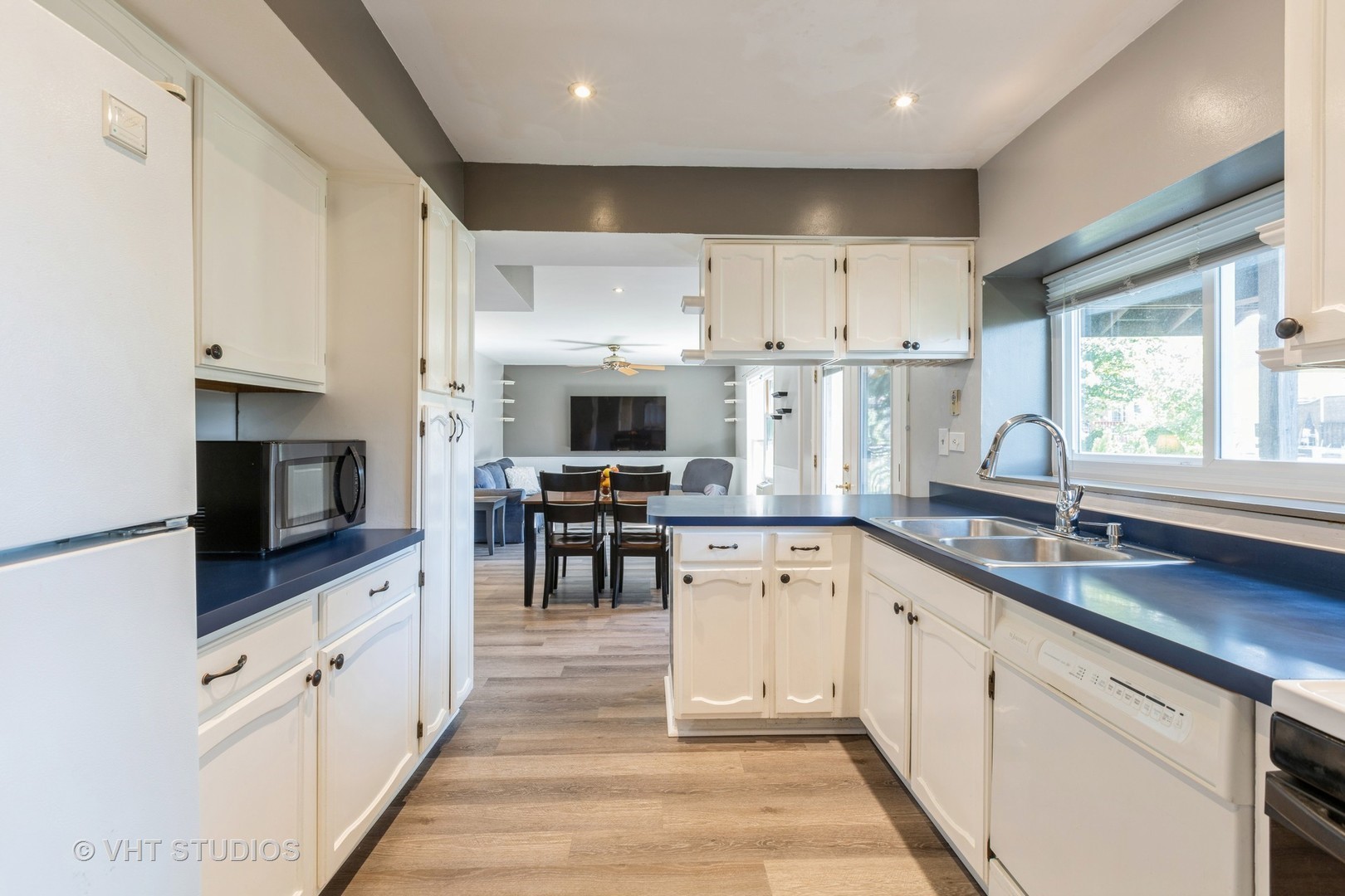 3256 Gresham Lane East Aurora, IL 60504 - Photo 7 of 14 a kitchen with white cabinets sink and stainless steel appliances