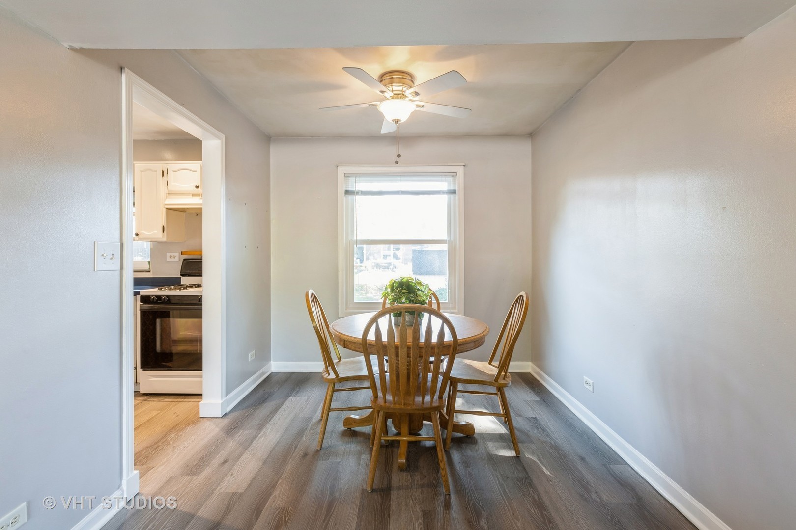 3256 Gresham Lane East Aurora, IL 60504 - Photo 9 of 14 a view of a dining room with furniture window and wooden floor