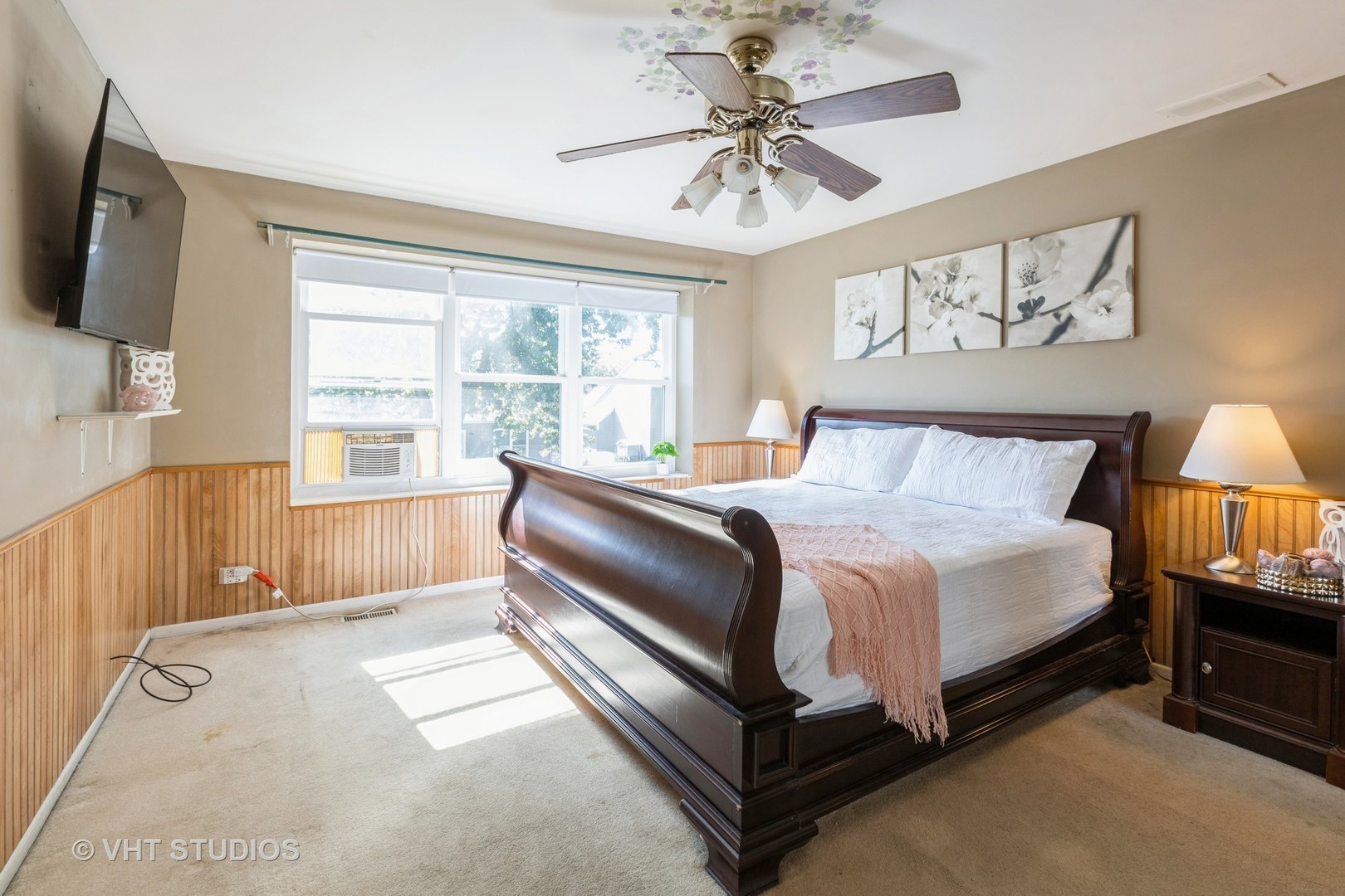 3256 Gresham Lane East Aurora, IL 60504 - Photo 10 of 14 a spacious bedroom with a bed a flat screen tv and a large window