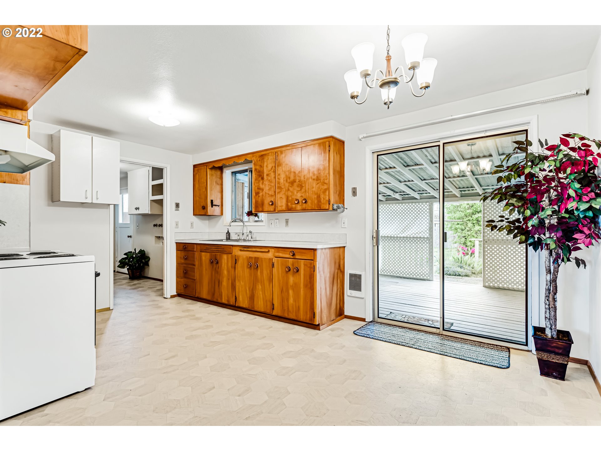 305 37th Street Springfield, OR 97478 - Photo 13 of 18 a kitchen with stainless steel appliances granite countertop a sink and cabinets