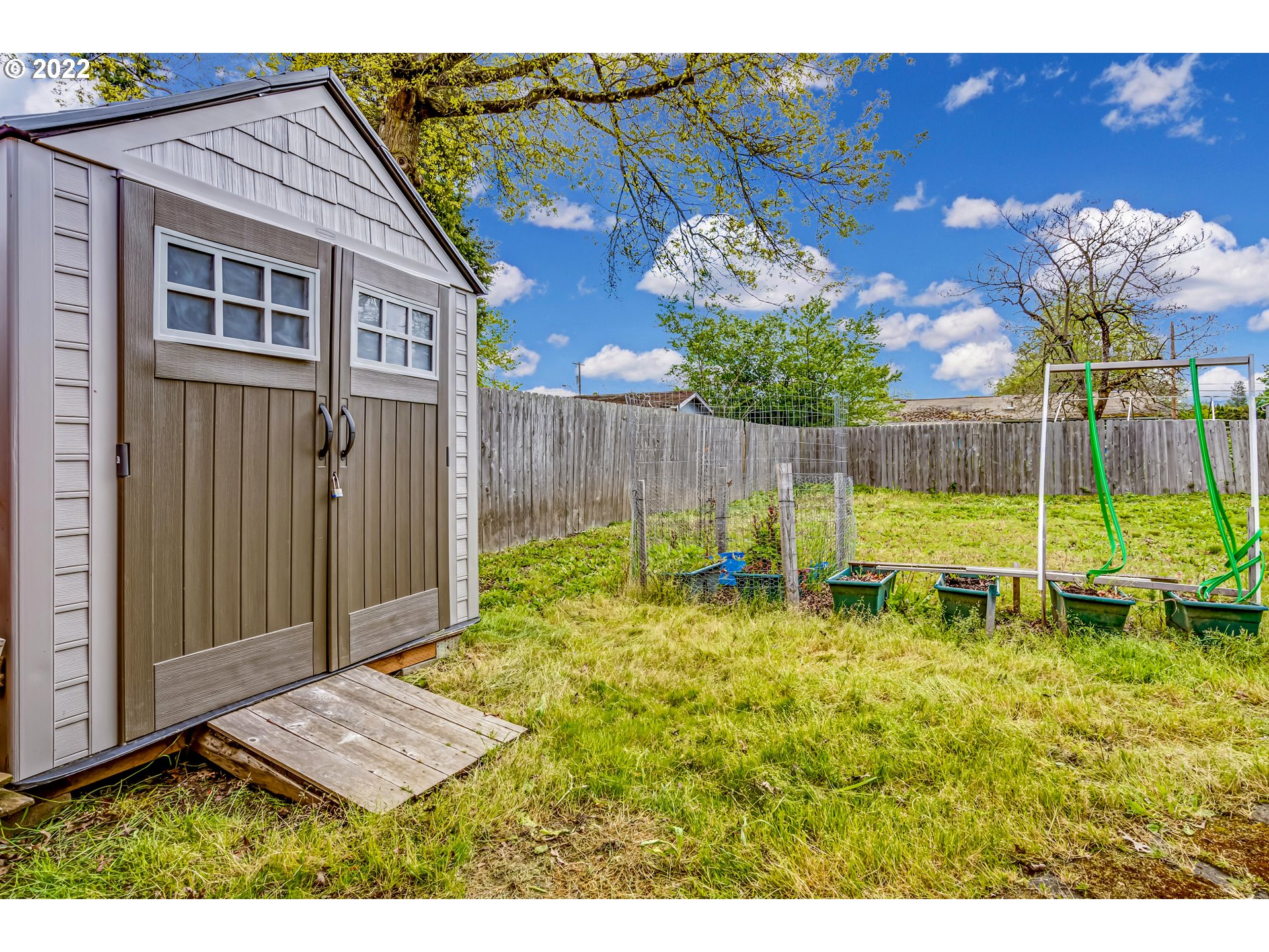 305 37th Street Springfield, OR 97478 - Photo 15 of 18 a backyard of a house with table and chairs
