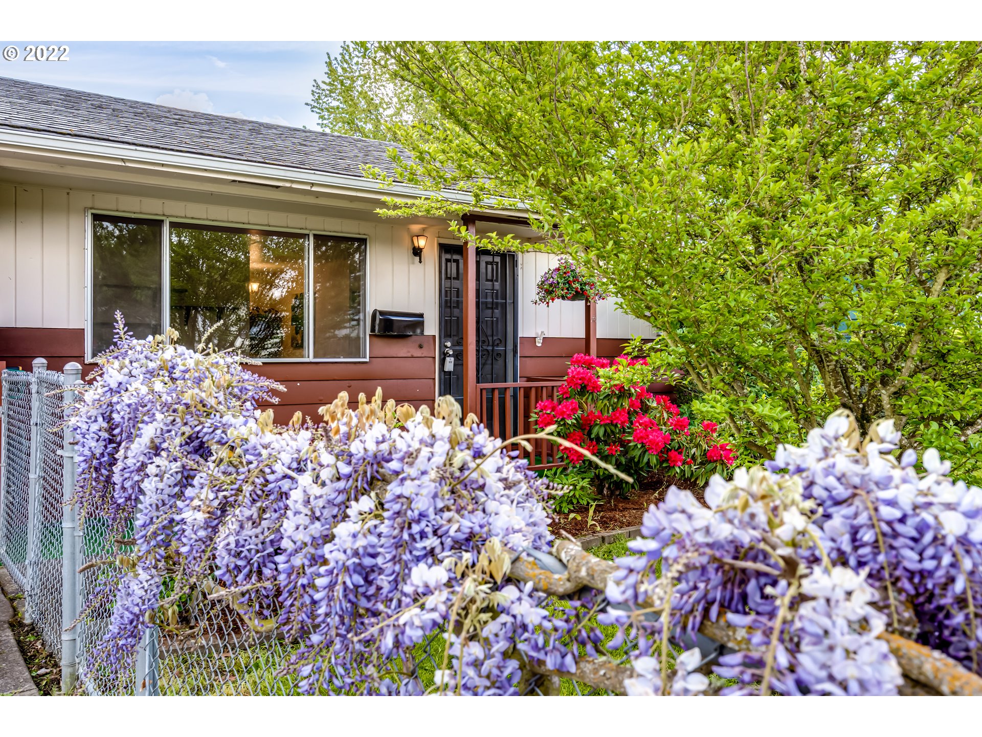 305 37th Street Springfield, OR 97478 - Photo 3 of 18 a front view of house with flowers