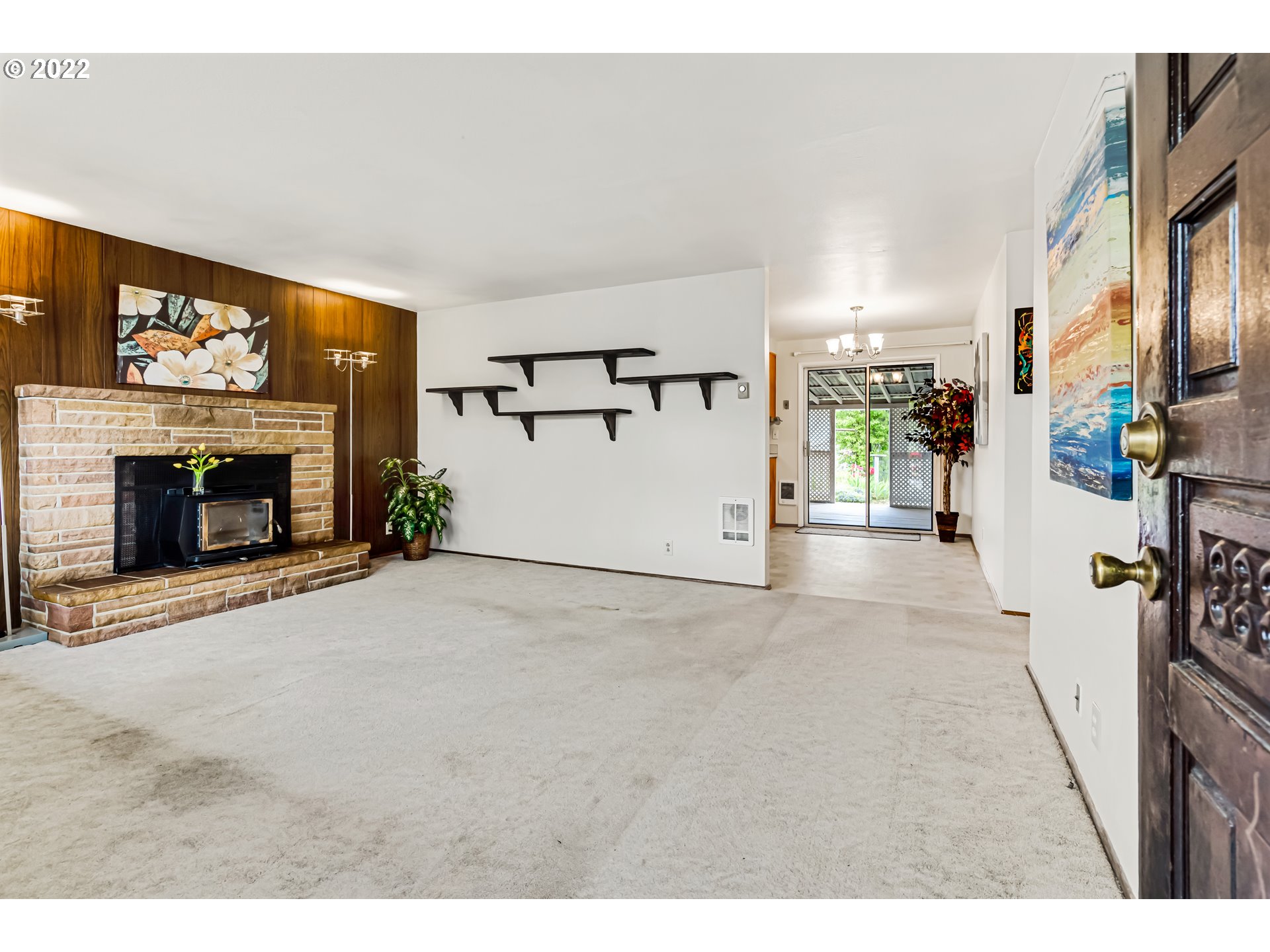 305 37th Street Springfield, OR 97478 - Photo 4 of 18 a view of a livingroom with a fireplace and a window