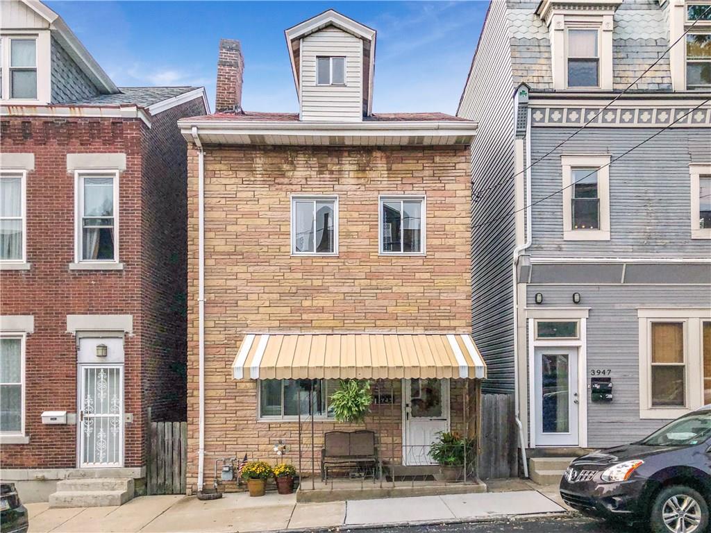 Awesome freestanding Colonial style brick home in Lawrenceville, right in the heart of all three main business districts on Penn Ave, Liberty Ave & Butler St!  