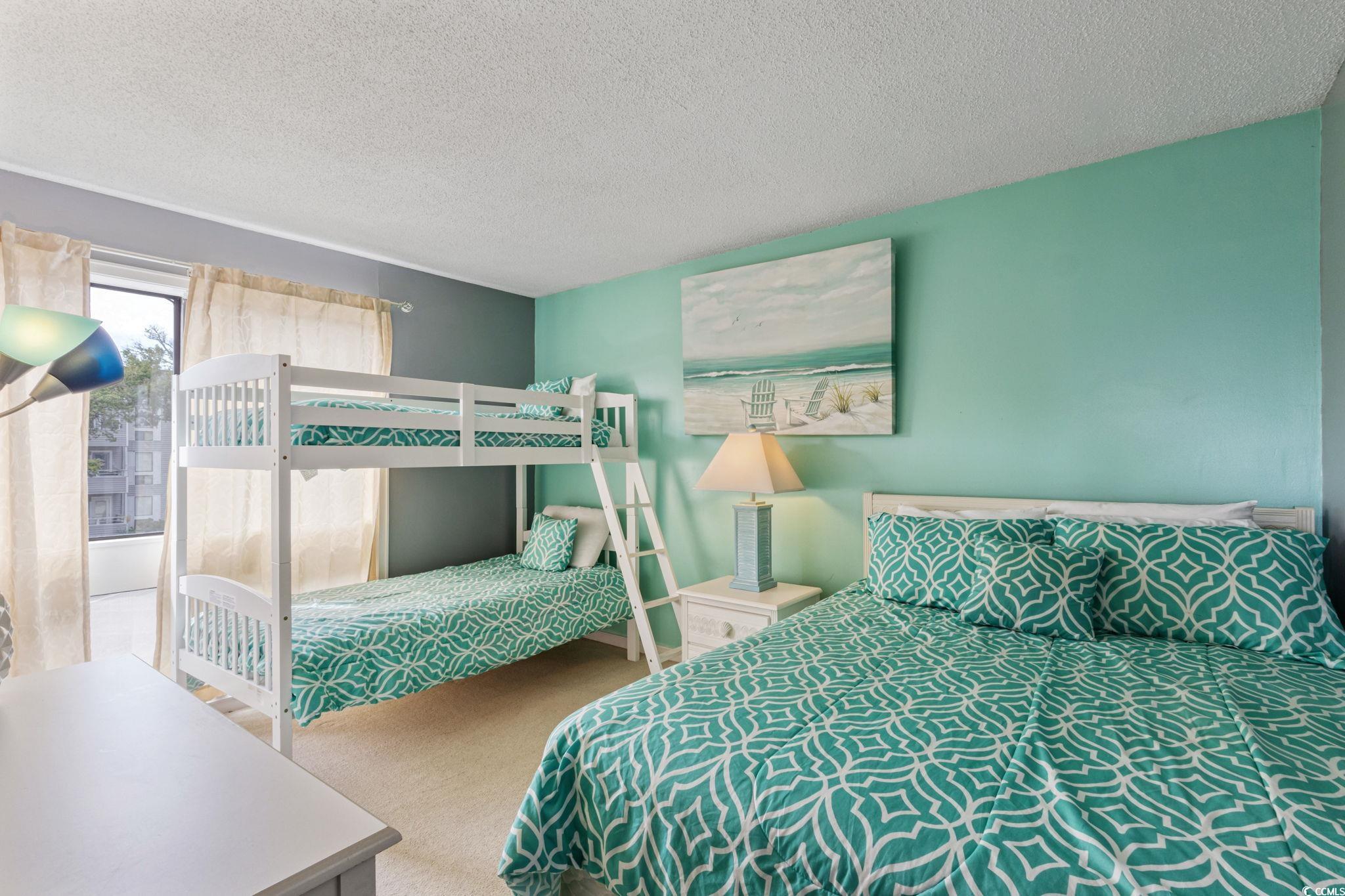 351 Lake Arrowhead Road, Unit 2206 Myrtle Beach, SC 29572 - Photo 18 of 40 Bedroom with a textured ceiling and carpet floors
