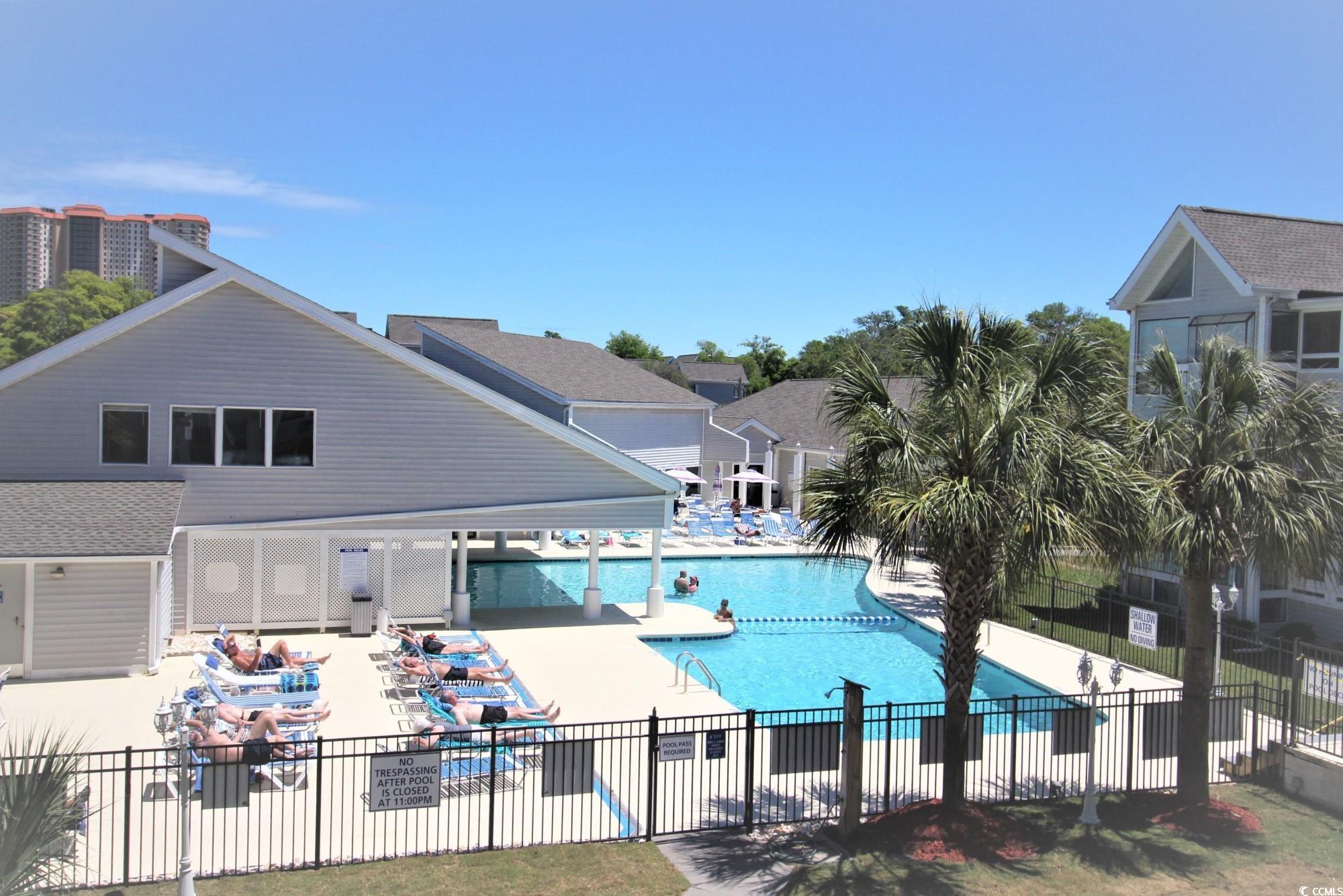 351 Lake Arrowhead Road, Unit 2206 Myrtle Beach, SC 29572 - Photo 25 of 40 Community pool featuring a patio