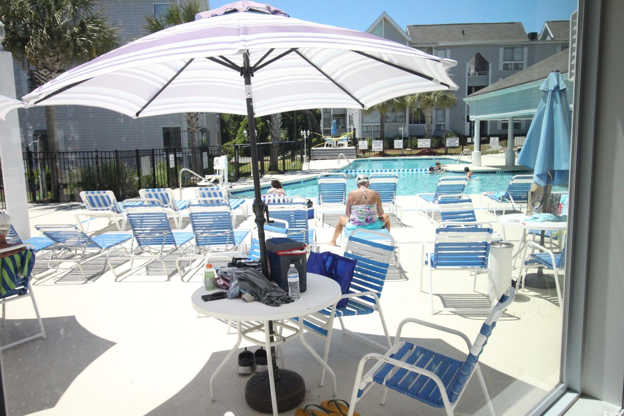 351 Lake Arrowhead Road, Unit 2206 Myrtle Beach, SC 29572 - Photo 26 of 40 Community pool featuring a patio