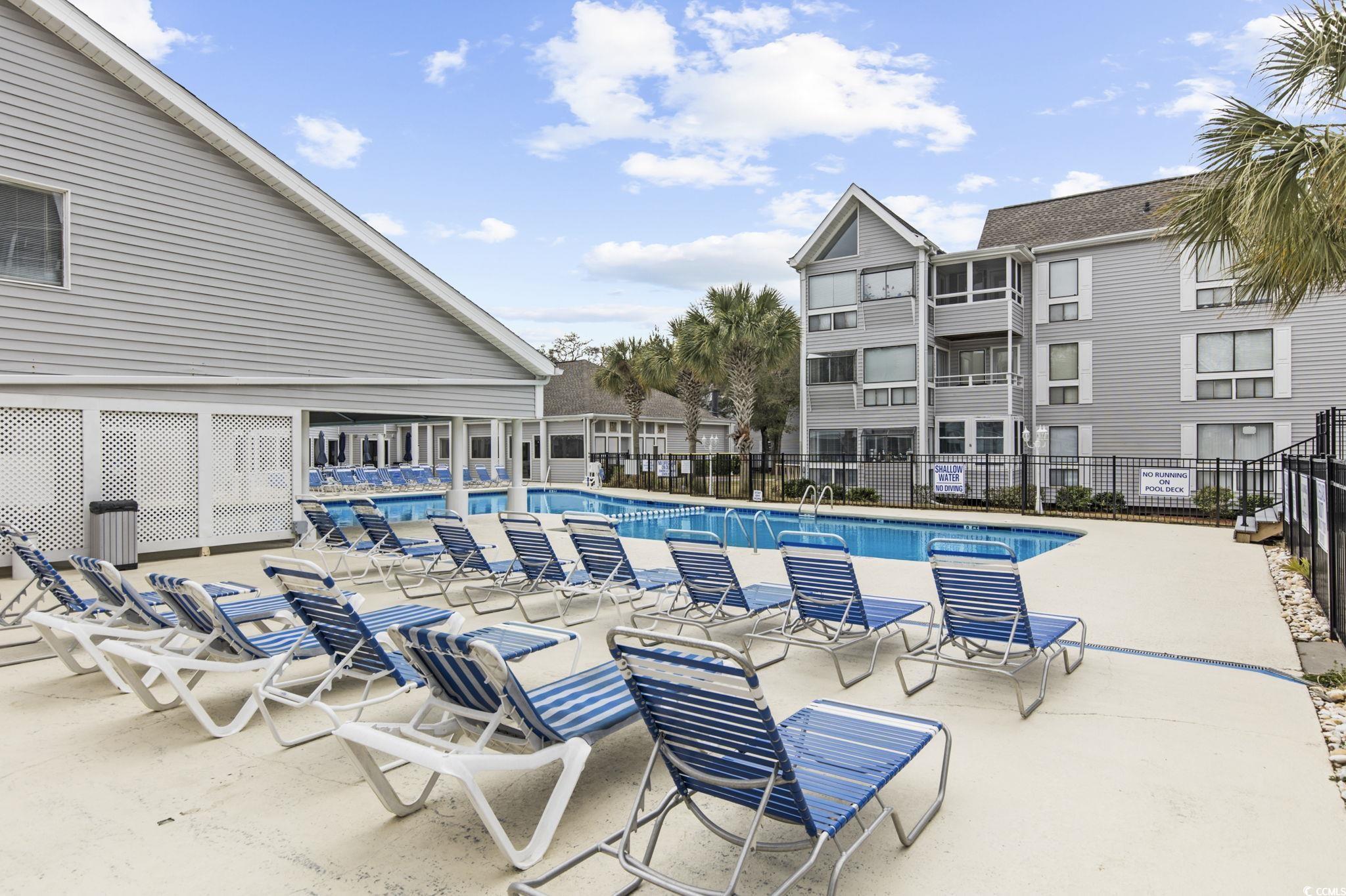 351 Lake Arrowhead Road, Unit 2206 Myrtle Beach, SC 29572 - Photo 27 of 40 Community pool with a patio