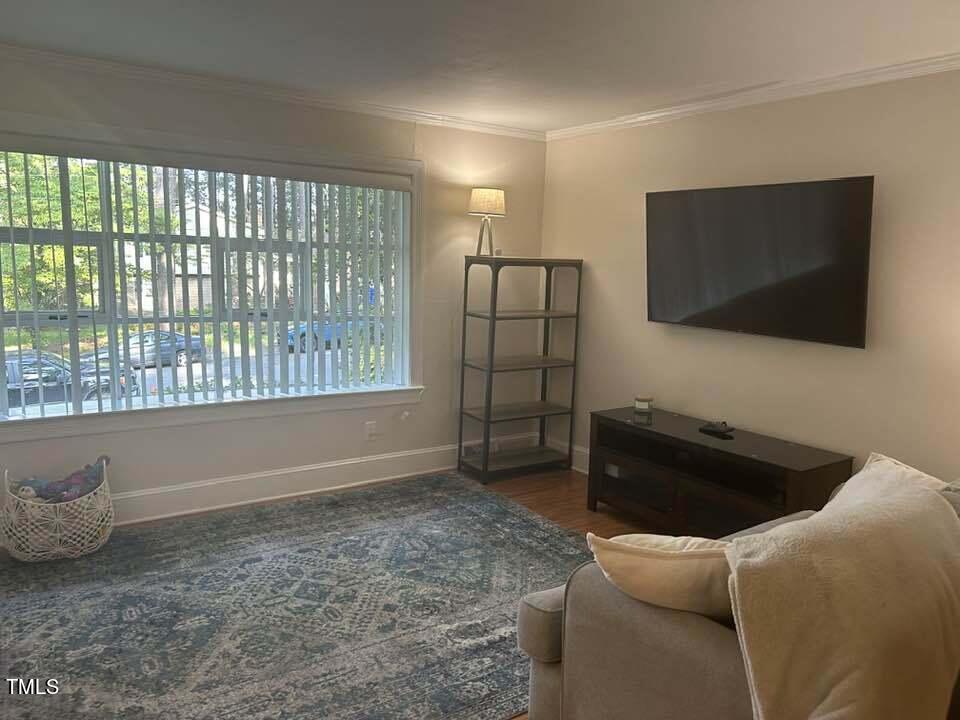 1608 Sulgrave Road Greenville, NC 27858 - Photo 11 of 31 a living room with furniture and a flat screen tv
