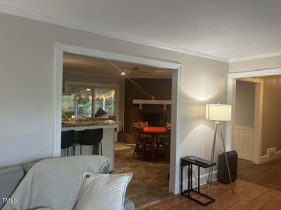 1608 Sulgrave Road Greenville, NC 27858 - Photo 12 of 31 a living room with furniture a table and large mirror next to a window