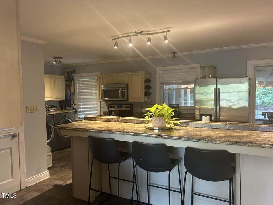 1608 Sulgrave Road Greenville, NC 27858 - Photo 17 of 31 a kitchen with a sink and chairs