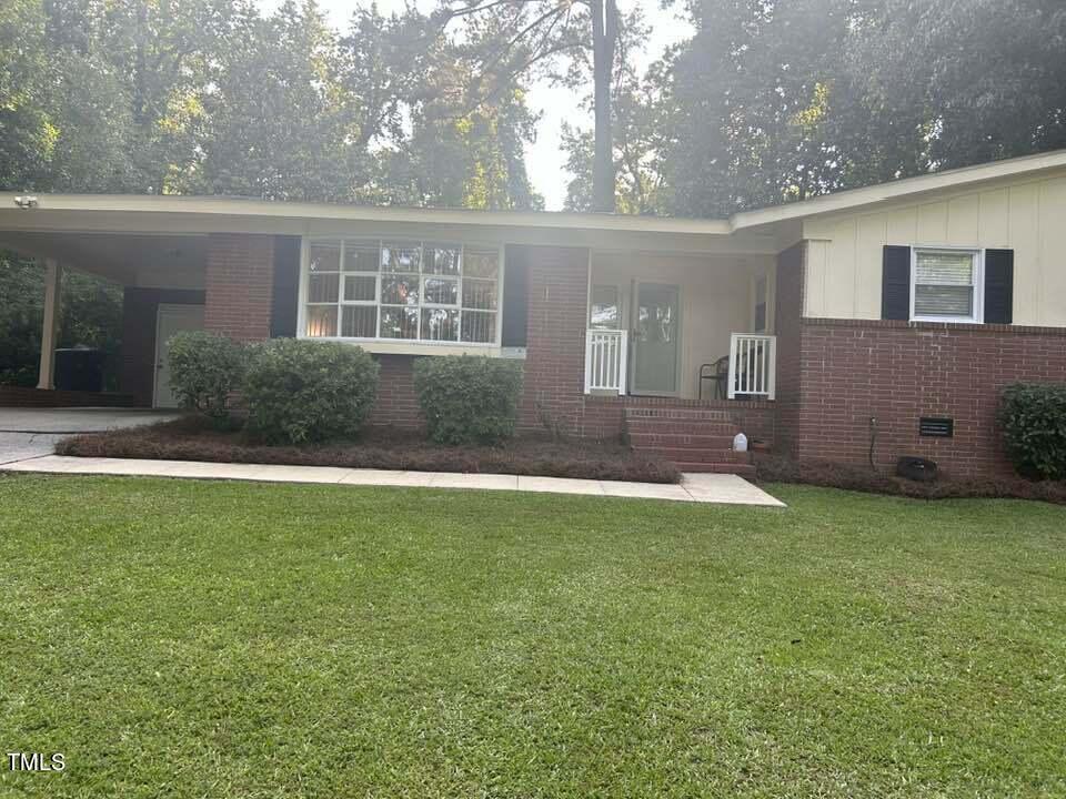 1608 Sulgrave Road Greenville, NC 27858 - Photo 4 of 31 a front view of a house with a yard