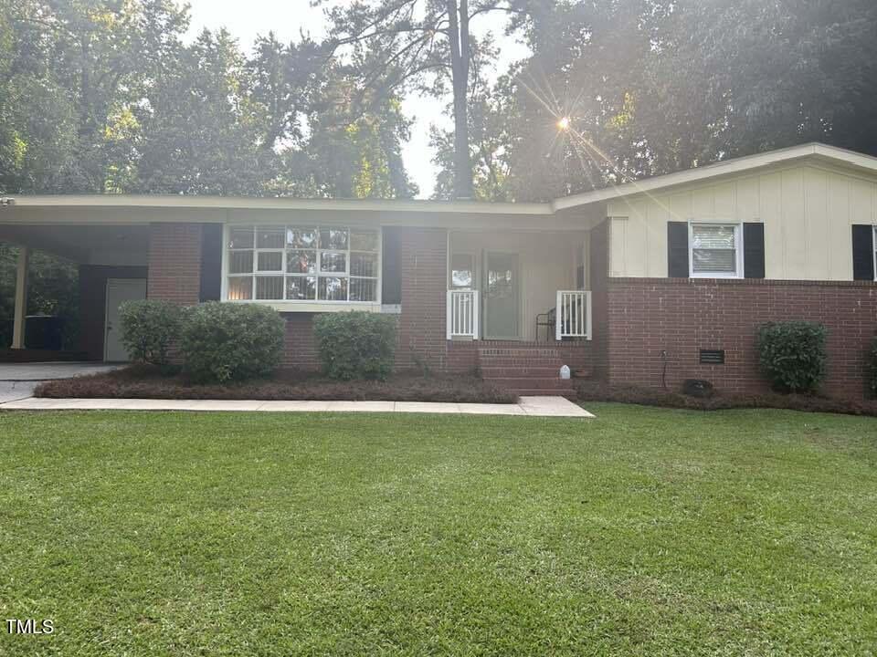 1608 Sulgrave Road Greenville, NC 27858 - Photo 5 of 31 a front view of a house with a yard