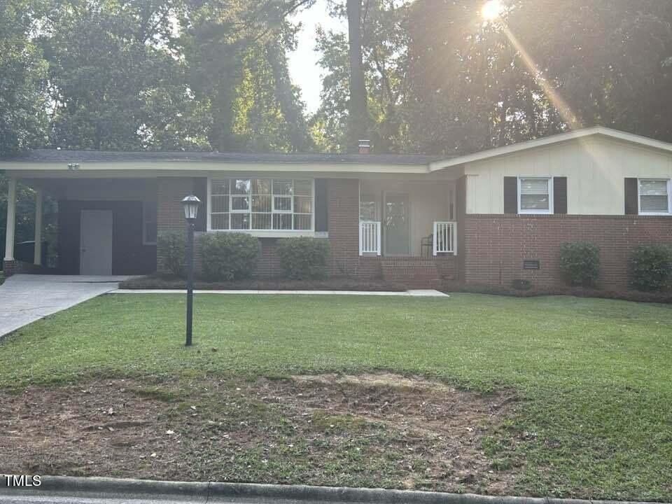 1608 Sulgrave Road Greenville, NC 27858 - Photo 6 of 31 a front view of a house with a garden