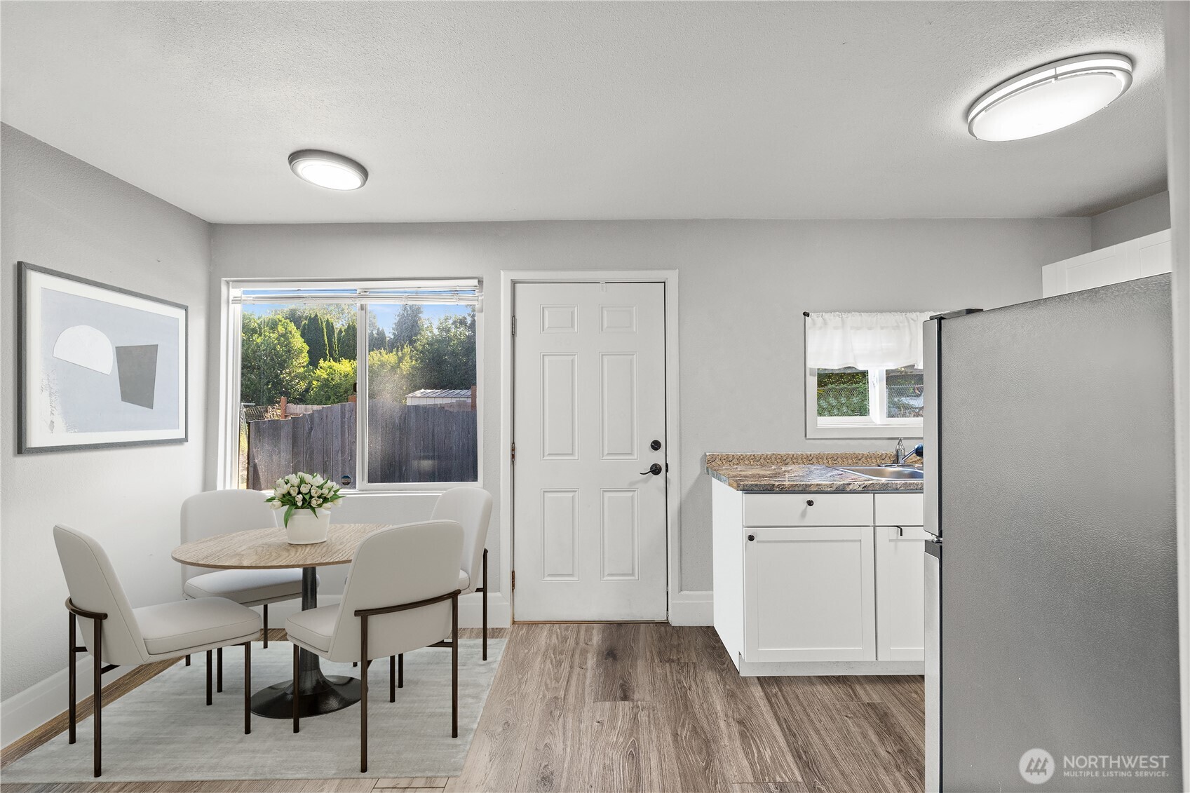 206 South Baker Street Mount Vernon, WA 98273 - Photo 12 of 31 a view of a dining room with furniture and wooden floor
