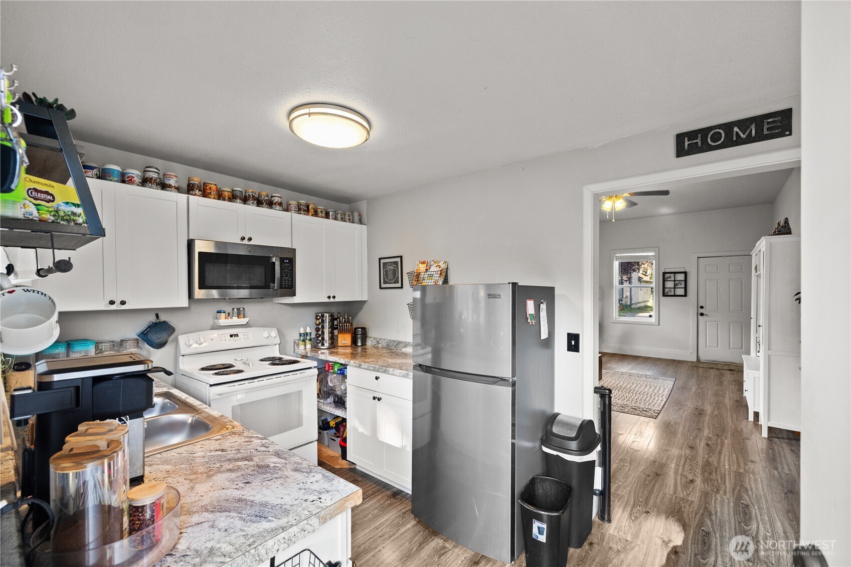 206 South Baker Street Mount Vernon, WA 98273 - Photo 13 of 31 a kitchen with stainless steel appliances a stove a refrigerator and a sink