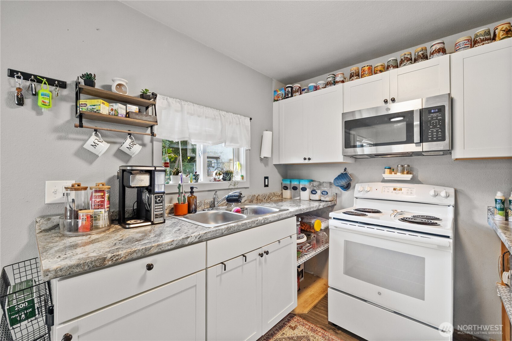 206 South Baker Street Mount Vernon, WA 98273 - Photo 15 of 31 a kitchen with granite countertop cabinets stainless steel appliances and a sink