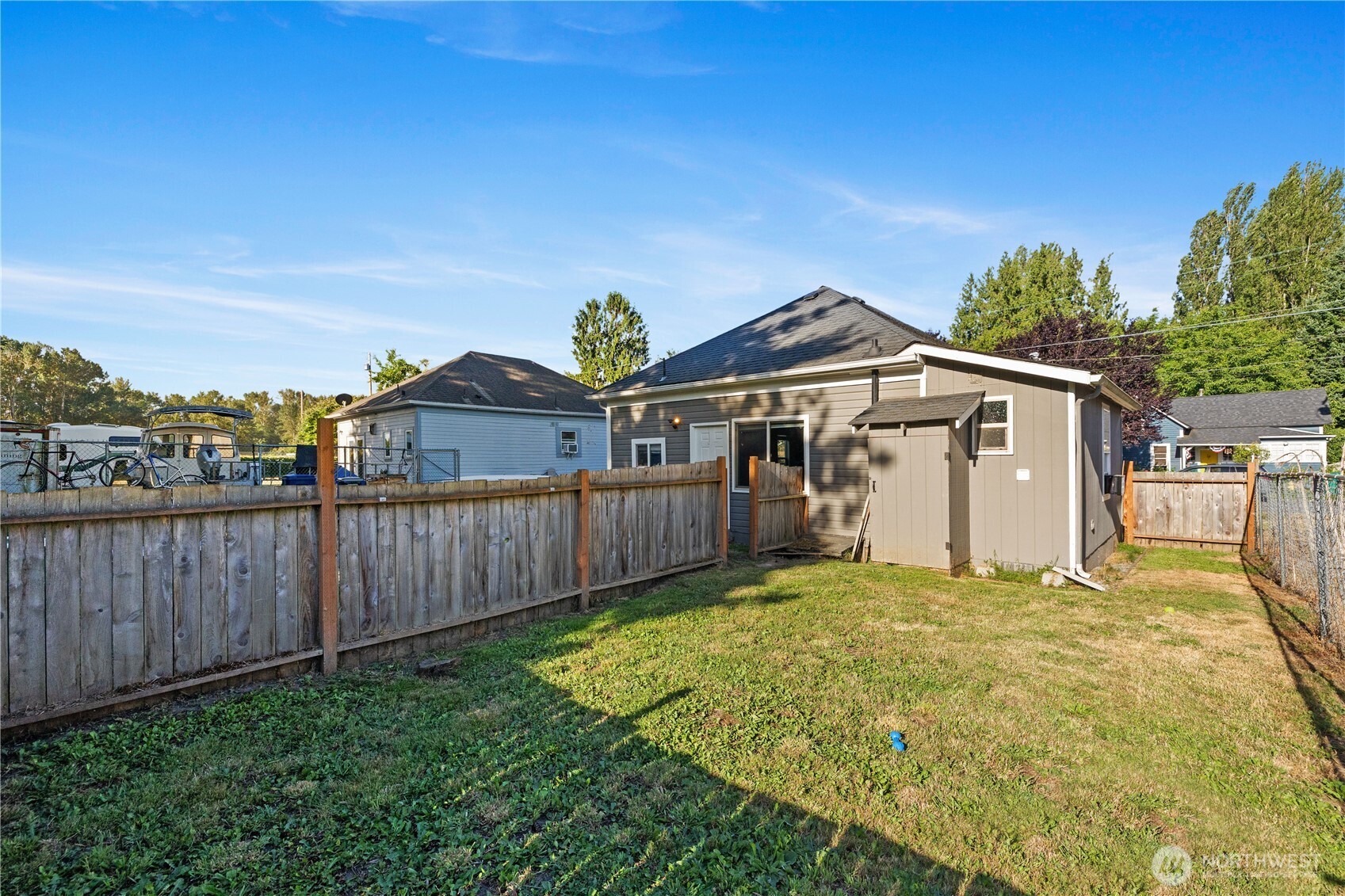 206 South Baker Street Mount Vernon, WA 98273 - Photo 22 of 31 a view of a house with a yard and wooden fence