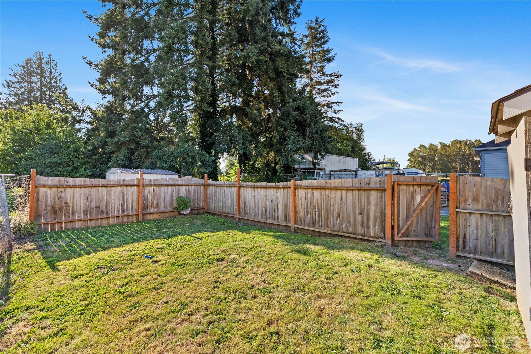 206 South Baker Street Mount Vernon, WA 98273 - Photo 23 of 31 a view of a backyard with wooden fence