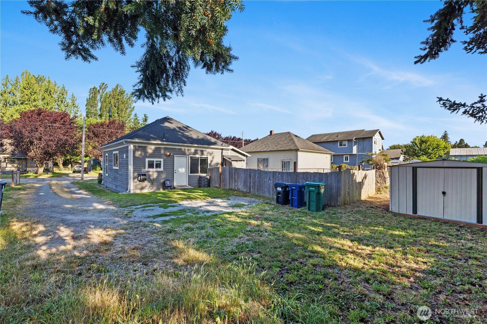 206 South Baker Street Mount Vernon, WA 98273 - Photo 24 of 31 a view of a big house with a big yard and potted plants