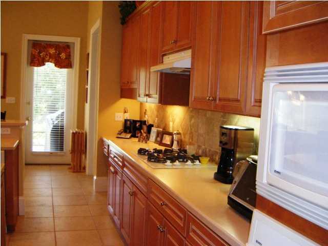 2913 Pine Valley Road Miramar Beach, FL 32550 - Photo 11 of 24 a kitchen with a sink and a refrigerator