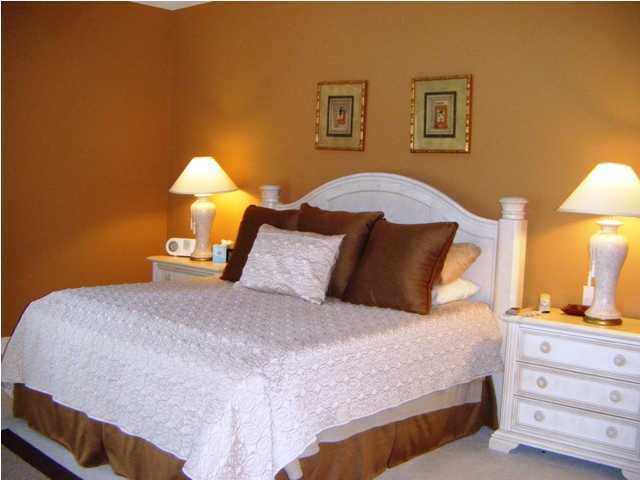 2913 Pine Valley Road Miramar Beach, FL 32550 - Photo 12 of 24 a bedroom with a bed and a lamp on dresser
