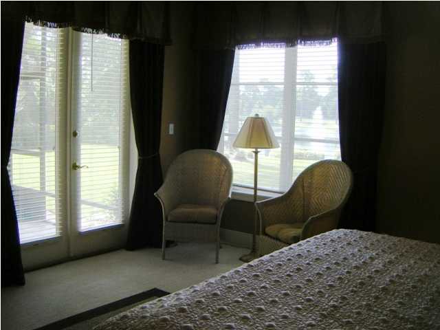 2913 Pine Valley Road Miramar Beach, FL 32550 - Photo 14 of 24 a bedroom with a bed chair and a window