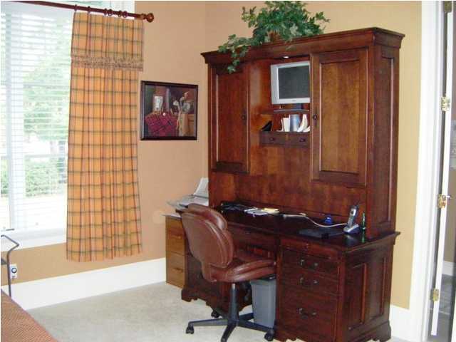 2913 Pine Valley Road Miramar Beach, FL 32550 - Photo 16 of 24 a room that has a dresser and a chair in it