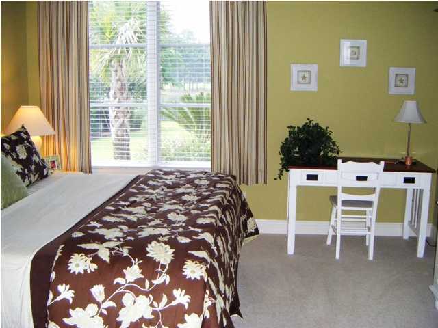 2913 Pine Valley Road Miramar Beach, FL 32550 - Photo 17 of 24 a bed sitting in a bedroom next to a window