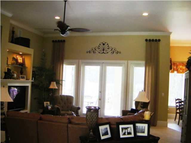 2913 Pine Valley Road Miramar Beach, FL 32550 - Photo 4 of 24 a living room with furniture a flat screen tv and a large window