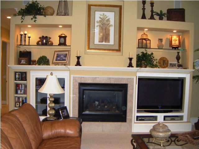 2913 Pine Valley Road Miramar Beach, FL 32550 - Photo 5 of 24 a living room with furniture and a fireplace
