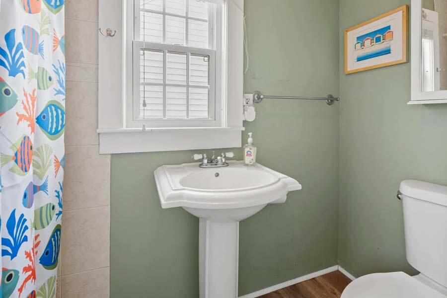 334 Shore Road, Unit 12 Truro, MA 02666 - Photo 18 of 19 a bathroom with a sink and a mirror
