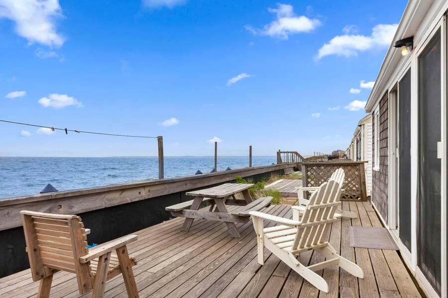 334 Shore Road, Unit 12 Truro, MA 02666 - Photo 4 of 19 a view of a balcony with furniture and wooden floor