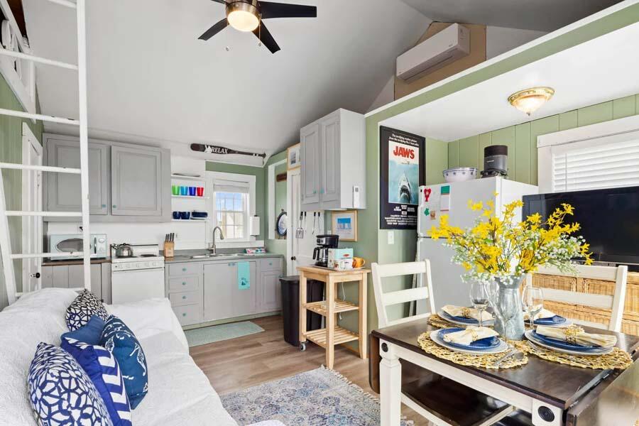 334 Shore Road, Unit 12 Truro, MA 02666 - Photo 8 of 19 a kitchen with sink stove and cabinets