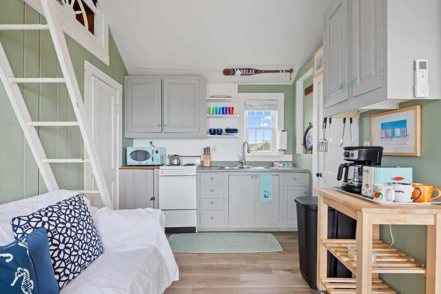 334 Shore Road, Unit 12 Truro, MA 02666 - Photo 9 of 19 a kitchen with a sink cabinets and window