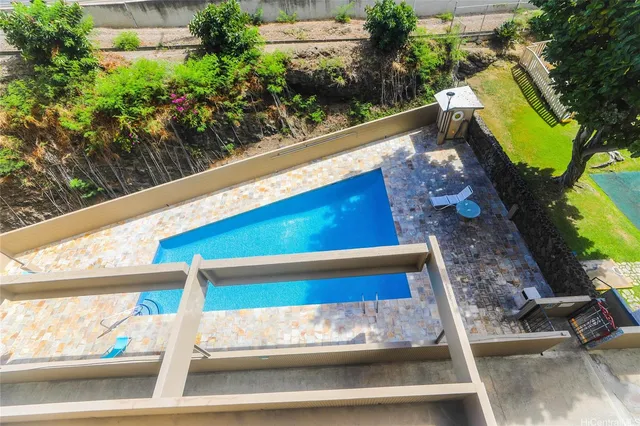 a view of swimming pool with outdoor seating