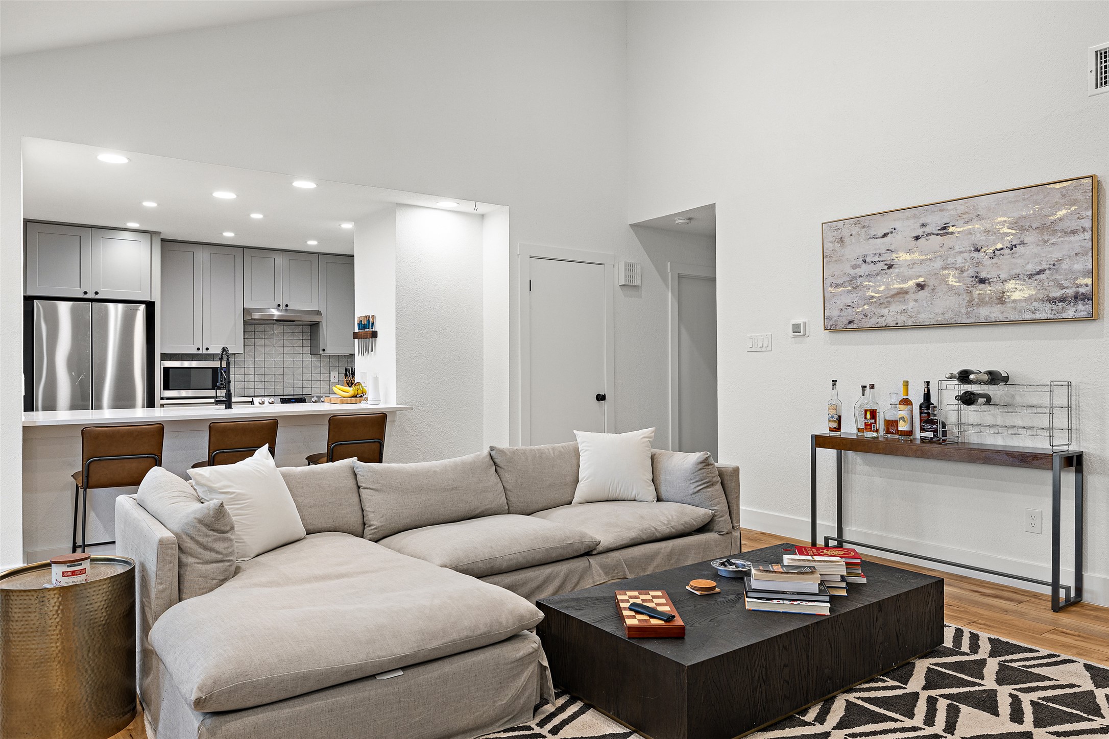 2001 Parker Lane, Unit 101 Austin, TX 78741 - Photo 4 of 33 a living room with furniture and kitchen view