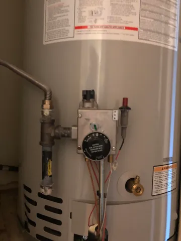 a backyard of a house with yard and trampoline