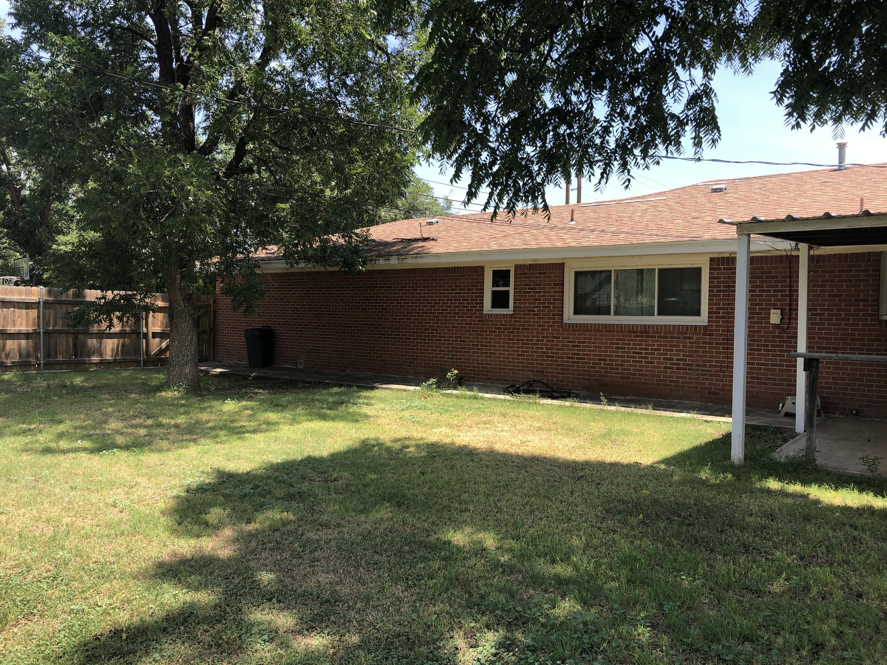 804 South Broadway Plainview, TX 79072 - Photo 40 of 46 a view of house with backyard space and swimming pool