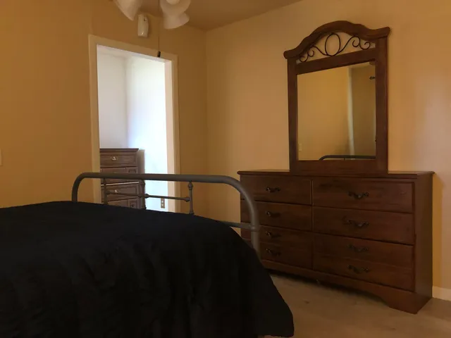 a view of a brick house with a large window