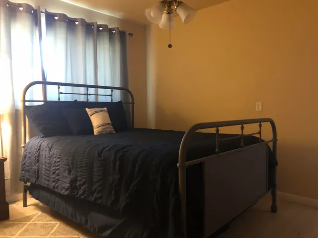 a view of a room with wooden walls