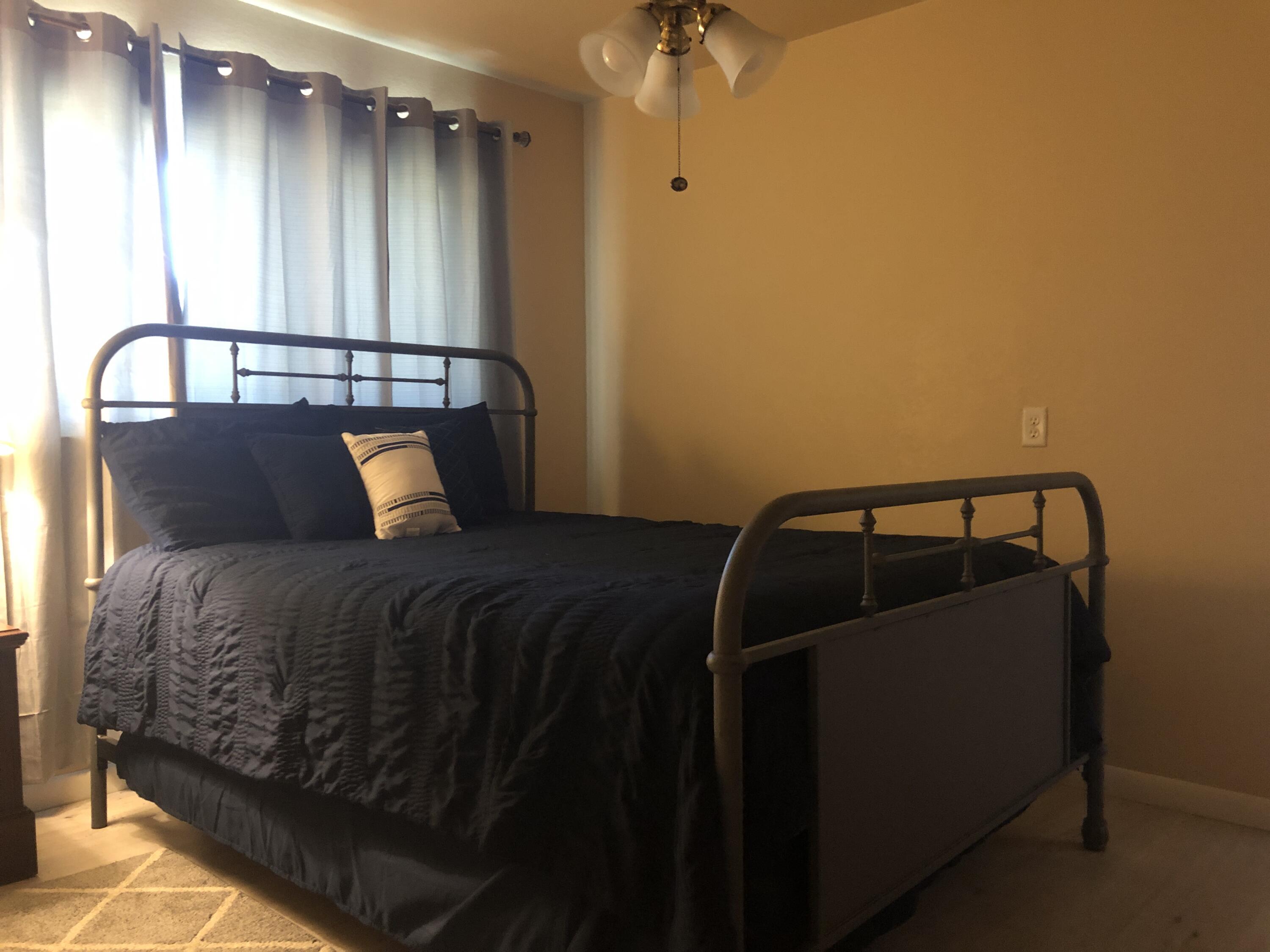 804 South Broadway Plainview, TX 79072 - Photo 42 of 46 a bedroom with a bed and a window