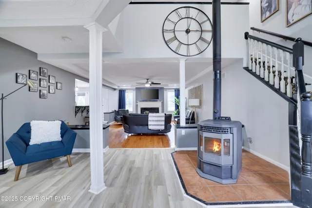 a living room with furniture and kitchen view