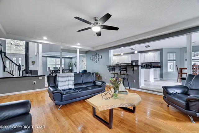 a living room with furniture fireplace and a flat screen tv