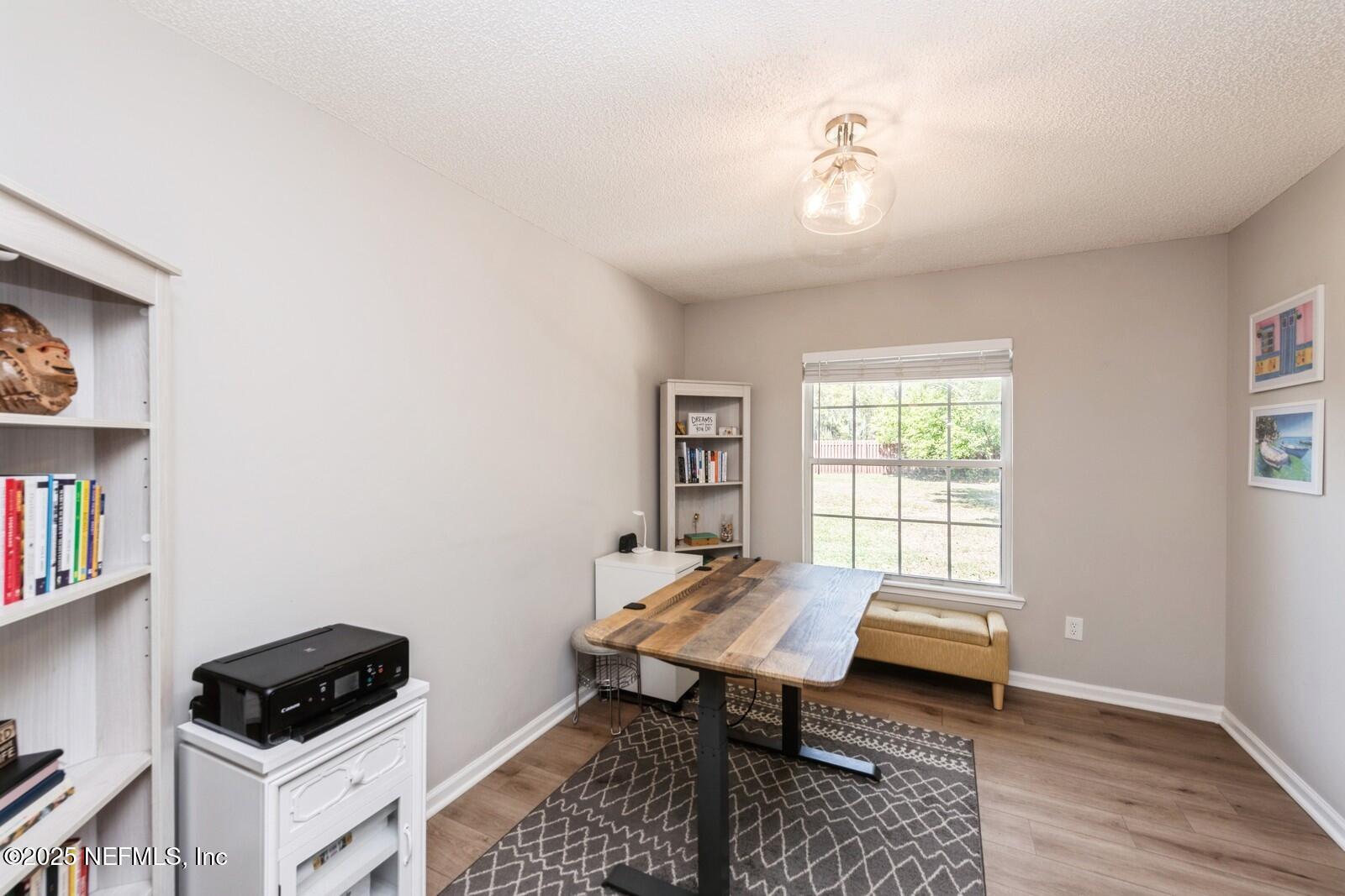 1962 Little River Drive Fleming Island, FL 32003 - Photo 14 of 29 a bedroom with furniture and a window
