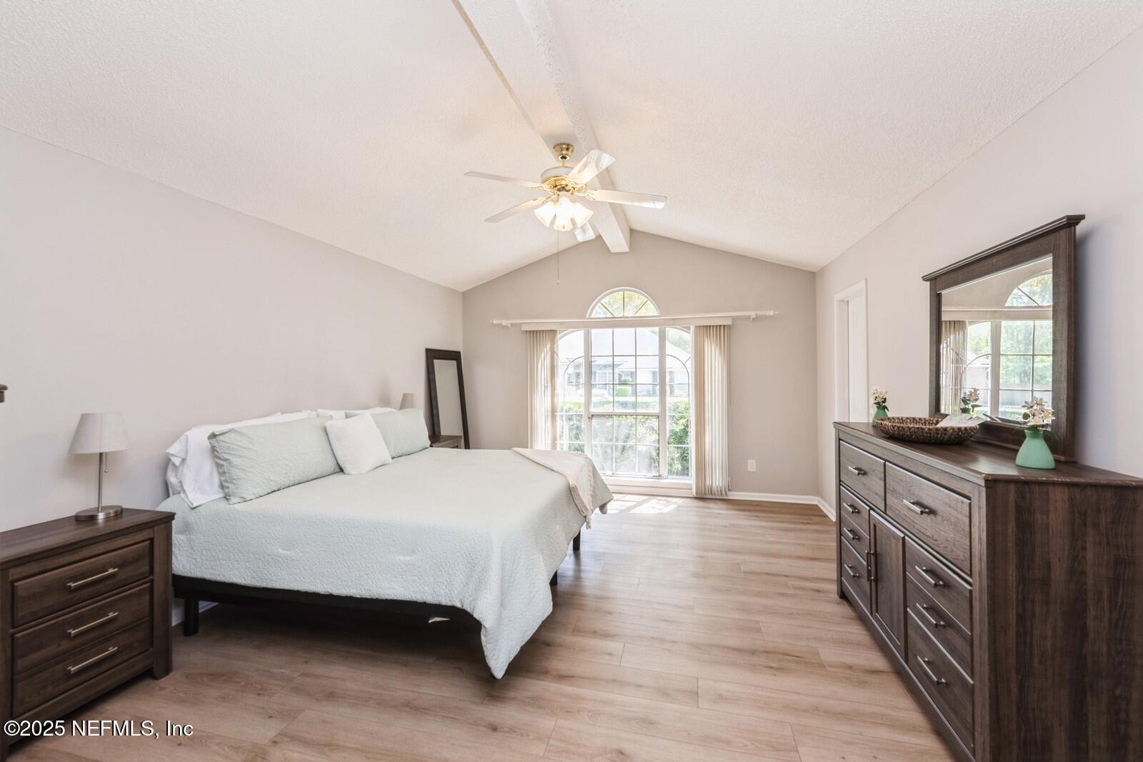 1962 Little River Drive Fleming Island, FL 32003 - Photo 16 of 29 a spacious bedroom with a bed dresser and a window