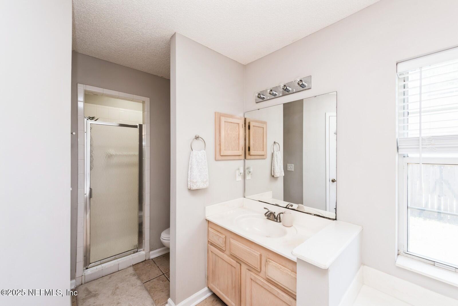 1962 Little River Drive Fleming Island, FL 32003 - Photo 19 of 29 a bathroom with a sink vanity tub and shower