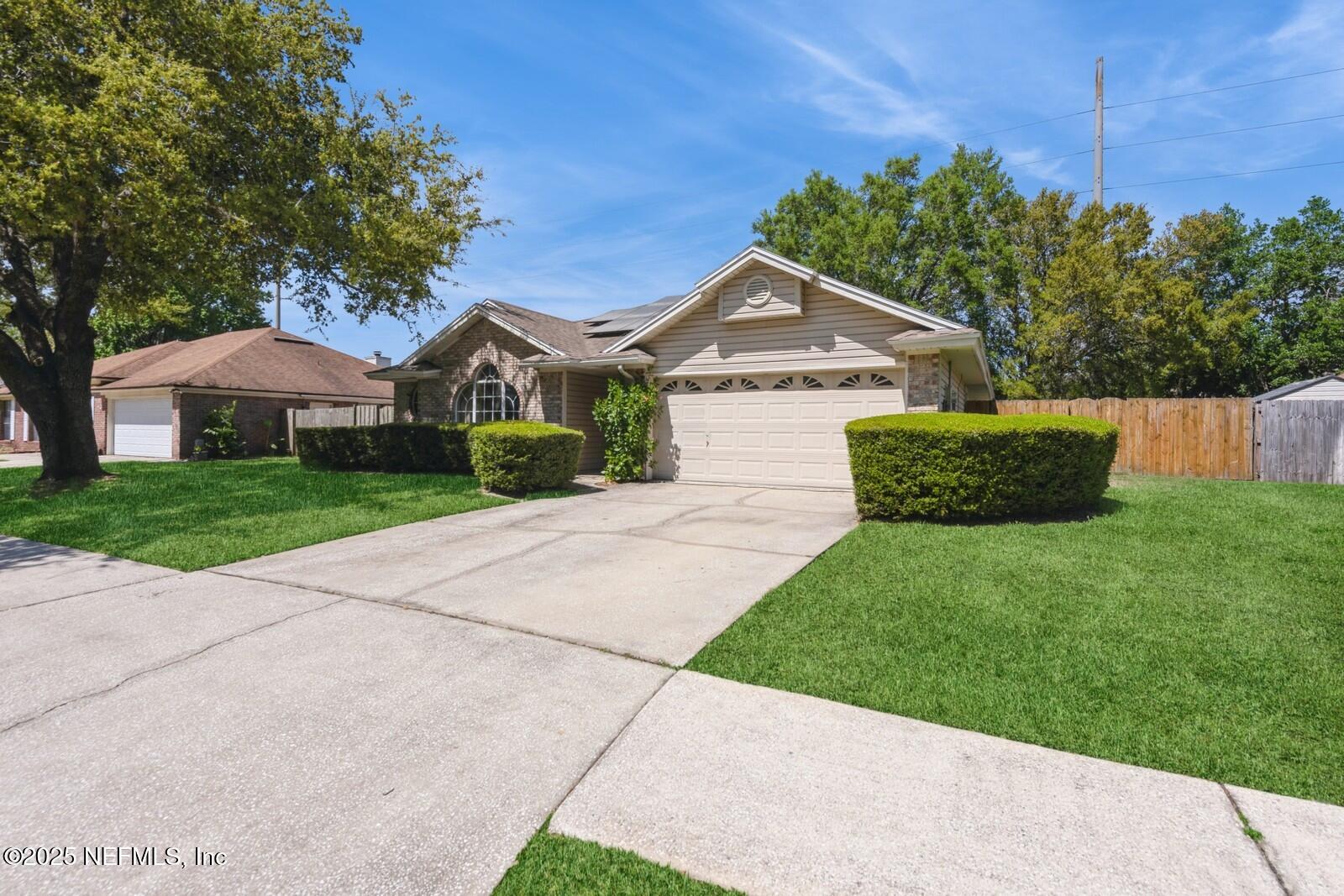 1962 Little River Drive Fleming Island, FL 32003 - Photo 3 of 29 a front view of a house with yard