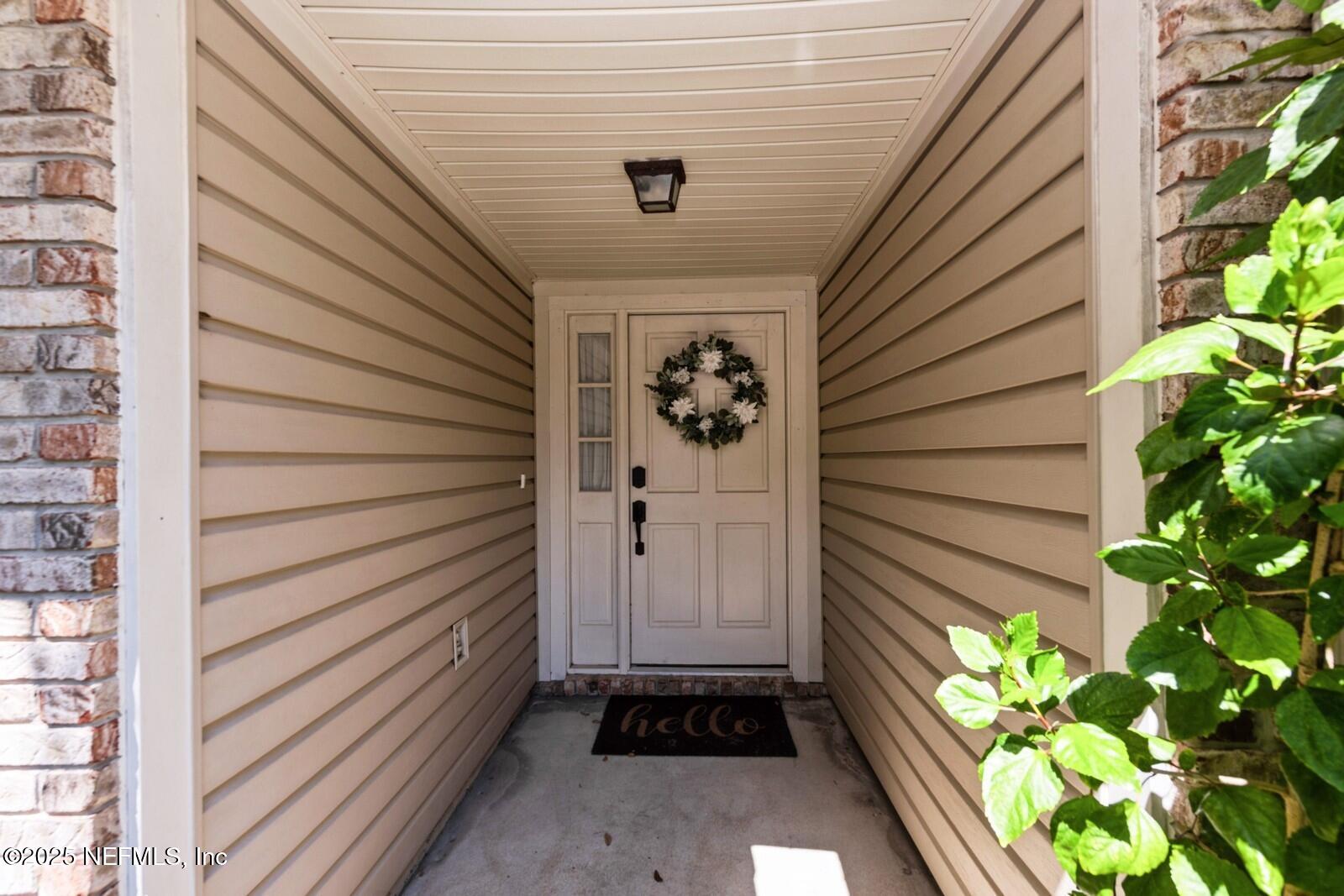 1962 Little River Drive Fleming Island, FL 32003 - Photo 4 of 29 a view of a entryway door of the house