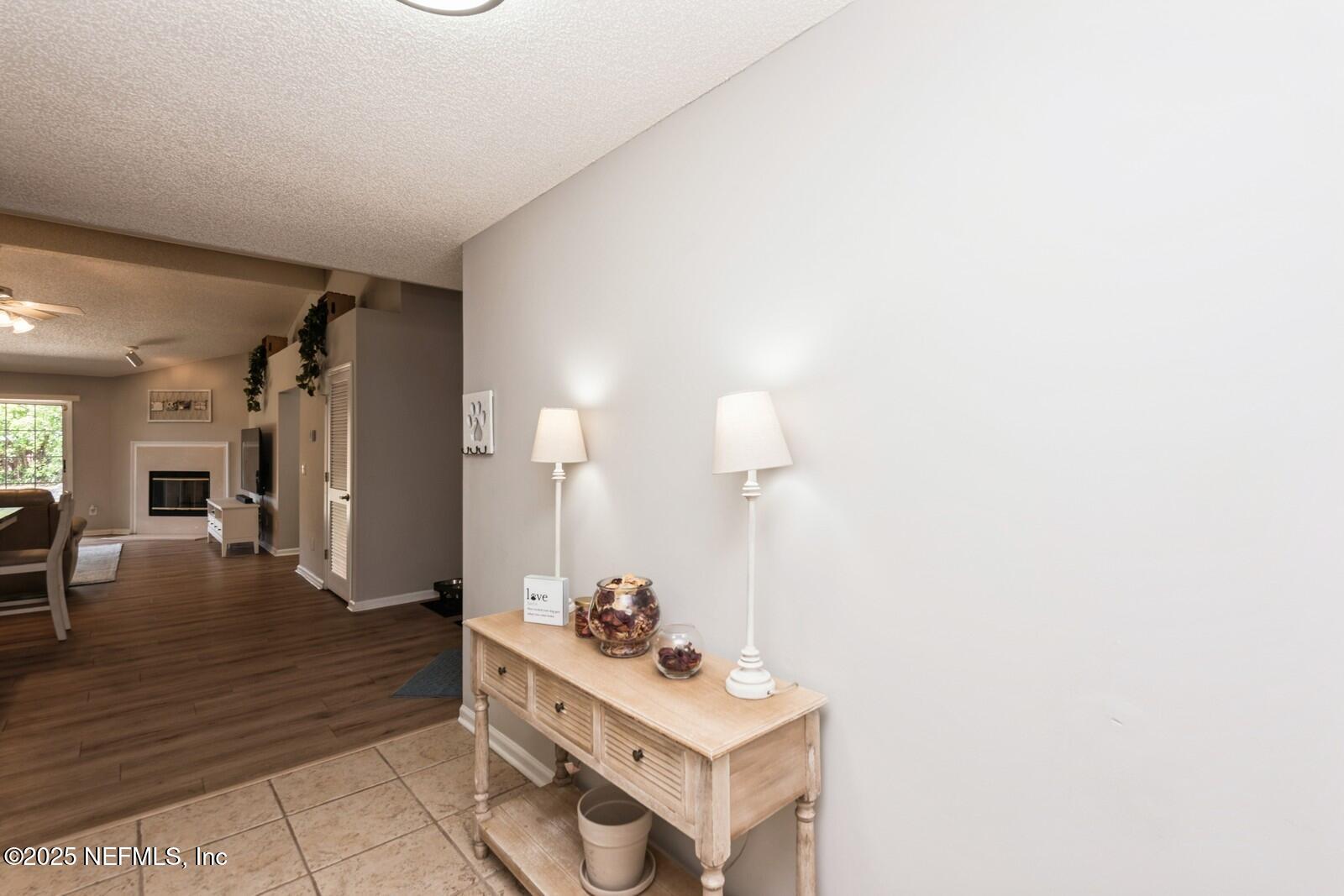 1962 Little River Drive Fleming Island, FL 32003 - Photo 5 of 29 a view of a hallway with couches and chandelier